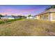 Expansive backyard featuring lush green grass and views of neighboring properties at 3935 Nemo Ave, North Port, FL 34287