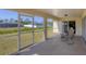 View of the backyard from the enclosed patio showcasing the property's outdoor space at 3935 Nemo Ave, North Port, FL 34287