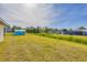 Spacious backyard with greenery and a shed, offering plenty of outdoor space at 3935 Nemo Ave, North Port, FL 34287