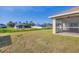 Expansive backyard view from the patio showing the property's outdoor space and privacy at 3935 Nemo Ave, North Port, FL 34287