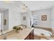Bright bathroom features a soaking tub under a window and double sinks with a large mirror at 3935 Nemo Ave, North Port, FL 34287