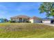 Charming single-story home featuring an attached two-car garage and well-maintained front lawn at 3935 Nemo Ave, North Port, FL 34287