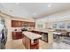 Open kitchen featuring an island, stainless steel appliances, and dark wood cabinets at 3935 Nemo Ave, North Port, FL 34287
