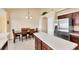 Kitchen with stainless steel refrigerator adjacent to dining area at 3935 Nemo Ave, North Port, FL 34287