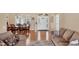 Open-concept living room with hardwood floors, neutral walls, and views into the dining room at 3935 Nemo Ave, North Port, FL 34287