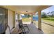 The enclosed patio provides a space to relax and enjoy the backyard views at 3935 Nemo Ave, North Port, FL 34287