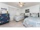 Cozy bedroom features matching twin beds and a blue decorative dresser for a comfortable retreat at 4022 Beaver Ln # 500C, Port Charlotte, FL 33952