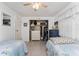 Cozy bedroom features twin beds and an organized closet storage for comfortable living at 4022 Beaver Ln # 500C, Port Charlotte, FL 33952
