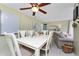 Inviting dining room with tile flooring, a ceiling fan, and natural light at 4022 Beaver Ln # 500C, Port Charlotte, FL 33952