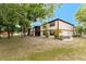 Inviting two-story condo featuring a screened balcony and surrounded by lush greenery and landscaping at 4022 Beaver Ln # 500C, Port Charlotte, FL 33952