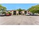 Exterior view of a well-maintained condo with a balcony and ample parking at 4022 Beaver Ln # 500C, Port Charlotte, FL 33952