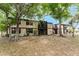 Complex shows mature trees, 2-story building with screened patio and overhanging decks at 4022 Beaver Ln # 500C, Port Charlotte, FL 33952