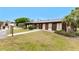 Charming single-story home with solar panels, a covered porch, and well-maintained landscaping at 4022 Beaver Ln # 500C, Port Charlotte, FL 33952
