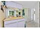 Charming kitchen with bar seating, pendant lighting, and an adjacent view of the living area at 4022 Beaver Ln # 500C, Port Charlotte, FL 33952