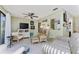 Bright living room with comfortable seating, a ceiling fan, and a sliding glass door at 4022 Beaver Ln # 500C, Port Charlotte, FL 33952
