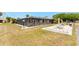 Community pool with a screened enclosure, ample seating, and a barbecue area with picnic tables at 4022 Beaver Ln # 500C, Port Charlotte, FL 33952