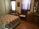 Bright bedroom with comfortable bed, natural light, and stylish decor at 5048 Palena Blvd, North Port, FL 34287