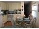 Cozy kitchen with dining area, modern appliances, and bright natural light at 5048 Palena Blvd, North Port, FL 34287