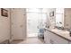 Bright bathroom features a granite countertop, white cabinets, and a walk-in shower at 5309 Shell Mound Cir, Punta Gorda, FL 33982