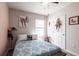 Comfortable bedroom featuring a ceiling fan, patterned bedspread, and bright natural light at 5309 Shell Mound Cir, Punta Gorda, FL 33982