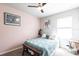 Cozy bedroom with ceiling fan, plush carpet, and a comfortable-looking bed at 5309 Shell Mound Cir, Punta Gorda, FL 33982