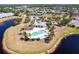 The community pool and pool house overlooking the pond at 5309 Shell Mound Cir, Punta Gorda, FL 33982