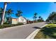 Exterior of the Calusa Creek community sign with palm trees against blue sky at 5309 Shell Mound Cir, Punta Gorda, FL 33982