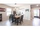 Inviting dining area with a large wooden table and seamless connection to the adjacent kitchen at 5309 Shell Mound Cir, Punta Gorda, FL 33982