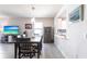 Open concept dining area with a table, chairs, and seamless connection to the adjacent kitchen at 5309 Shell Mound Cir, Punta Gorda, FL 33982