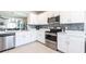 Modern kitchen boasting white cabinets, stainless steel appliances, and an open layout at 5309 Shell Mound Cir, Punta Gorda, FL 33982
