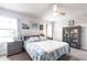 Spacious main bedroom with light gray walls, soft carpeting, and ceiling fan at 5309 Shell Mound Cir, Punta Gorda, FL 33982