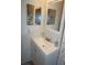 Bathroom featuring a modern vanity with a white sink and contemporary mirror at 6249 Drucker Cir, Port Charlotte, FL 33981
