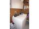 Laundry room with new, high efficiency washing machine and storage shelves at 6249 Drucker Cir, Port Charlotte, FL 33981