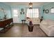 Cozy living room with tile floors, neutral furniture, and ample natural light through large windows at 6249 Drucker Cir, Port Charlotte, FL 33981