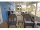 Covered patio with furniture, plants, and a view of the backyard, perfect for relaxing at 6249 Drucker Cir, Port Charlotte, FL 33981