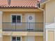 Charming condo entrance featuring a decorative wreath and well-kept balcony at 7196 N Plum Tree # 323, Punta Gorda, FL 33955