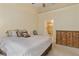 Comfortable primary bedroom featuring a large bed, en-suite bathroom, and spacious dresser at 7196 N Plum Tree # 323, Punta Gorda, FL 33955