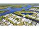 Charming waterfront homes in a serene community with access to winding waterways at 724 Blackburn Blvd, North Port, FL 34287