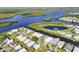 Stunning aerial view of waterfront community with picturesque winding waterways and lush surroundings at 724 Blackburn Blvd, North Port, FL 34287