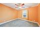 Cozy bedroom featuring carpeted floors, and a bright window at 724 Blackburn Blvd, North Port, FL 34287
