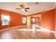 Spacious bedroom with mirrored closet, laminate flooring, natural lighting and ceiling fan at 724 Blackburn Blvd, North Port, FL 34287