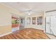 Dining room featuring wood floors and sliding glass doors with access to the lanai and backyard area at 724 Blackburn Blvd, North Port, FL 34287
