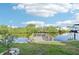 Home's dock featuring a wooden platform for enjoying water views and canal access at 724 Blackburn Blvd, North Port, FL 34287