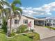 Charming home exterior with lush front yard and convenient carport at 724 Blackburn Blvd, North Port, FL 34287