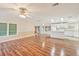 Spacious living room with laminate floors, ceiling fan and a combined kitchen at 724 Blackburn Blvd, North Port, FL 34287