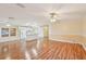 Spacious living room with laminate floors, ceiling fan and a combined kitchen at 724 Blackburn Blvd, North Port, FL 34287