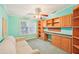 Inviting home office with custom built-in shelving, storage, and a cozy sofa at 724 Blackburn Blvd, North Port, FL 34287