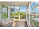 Screened porch with views of the canal, plus a door with access to a boat dock at 724 Blackburn Blvd, North Port, FL 34287