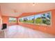 Bright sun room with large windows that overlook the backyard waterfront views, and tiled flooring at 724 Blackburn Blvd, North Port, FL 34287