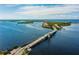 Beautiful aerial view of bridge spanning waterway connecting islands and communities at 861 Seabrooke Dr, Englewood, FL 34223